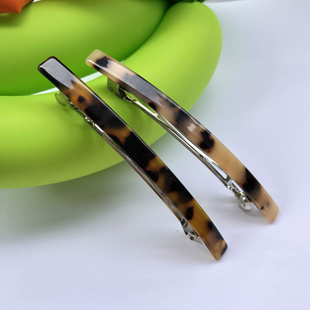 HYFEEL long French barrette worn in hair for everyday chic look.