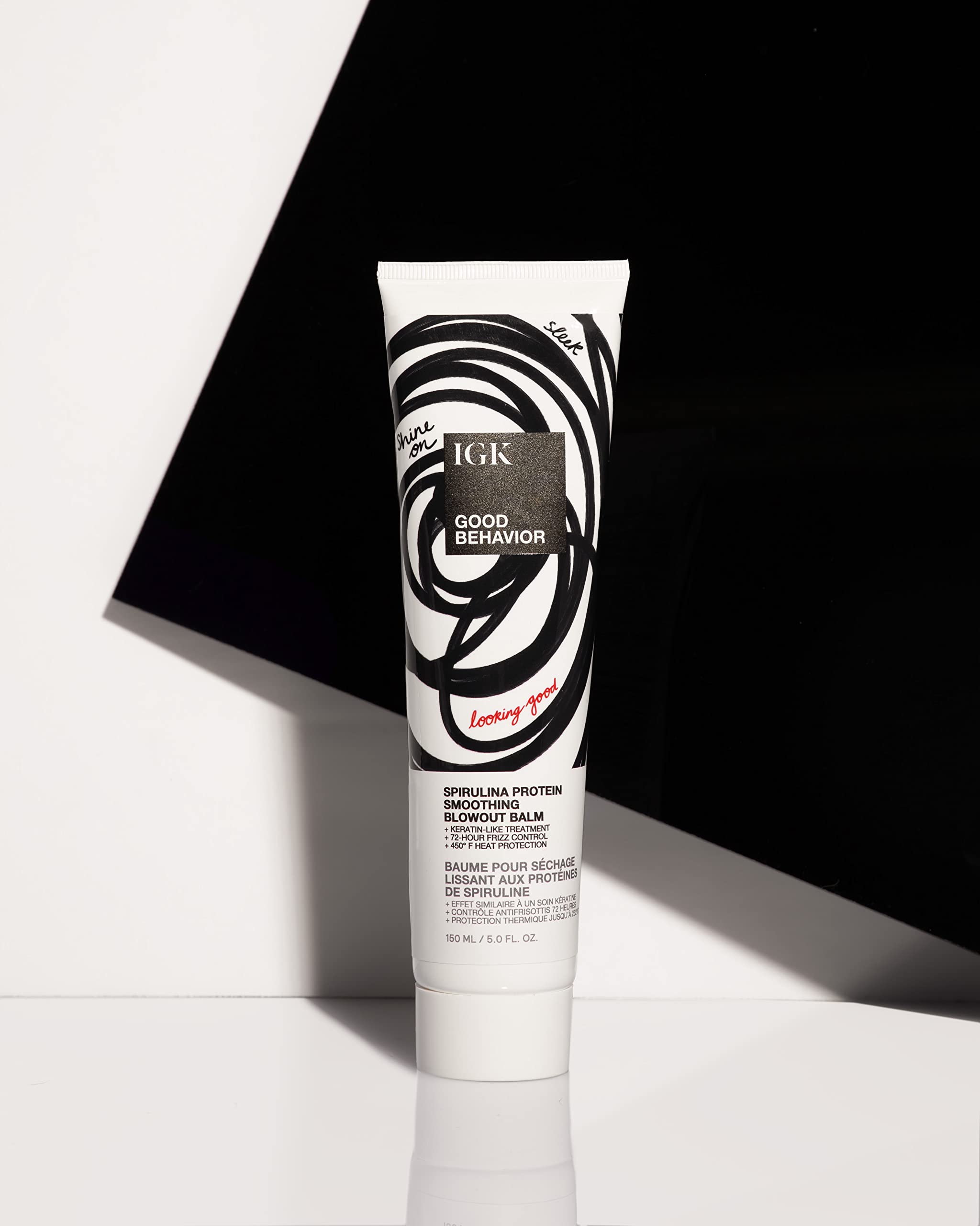 IGK Good Behavior balm applied in hands for easy distribution