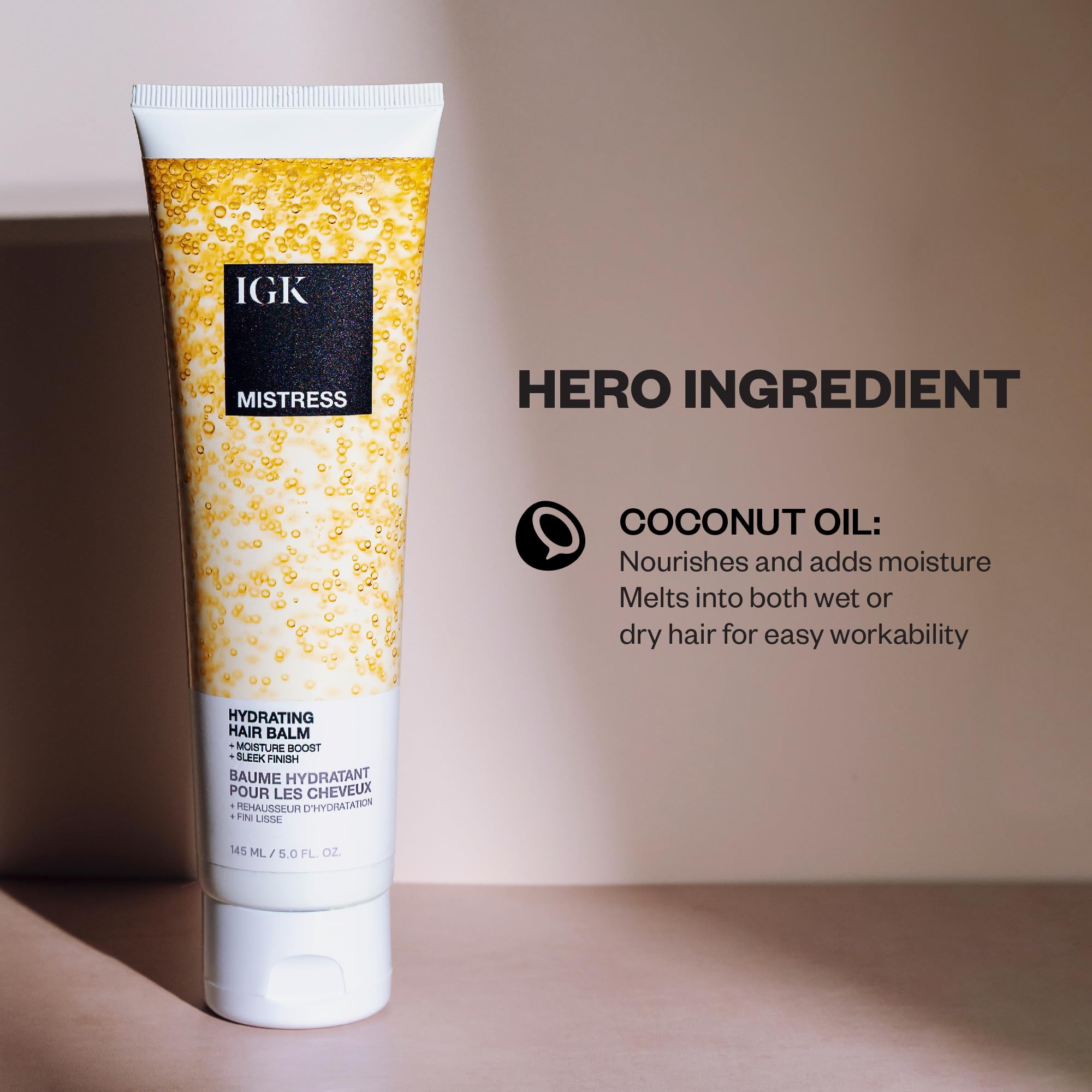 IGK Mistress hair balm texture close-up shows smooth, frizz-control feel.