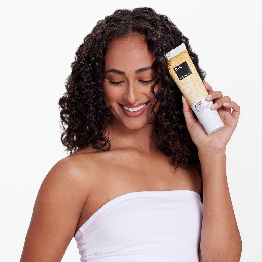 IGK Mistress hydrating hair balm jar closeup reveals creamy texture for softness.