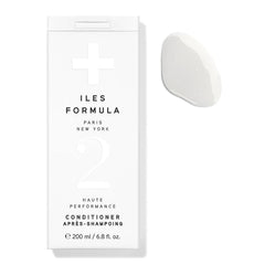 ILES FORMULA conditioner bottle offers deep hydration for dry, damaged hair.