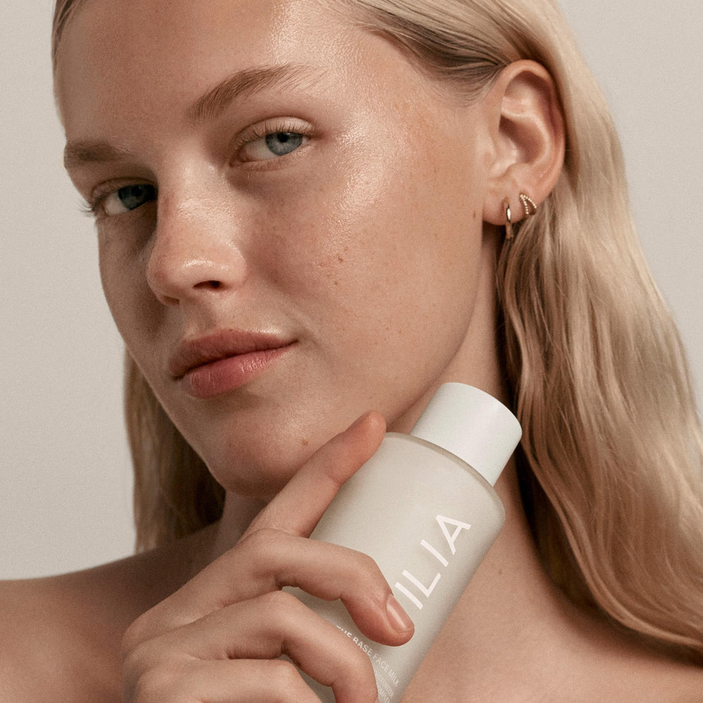 ILIA Base Face Milk Essence pump-action demonstrates clean, effortless application.