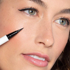 ILIA Clean Line Liquid Liner swatches on arm reveal Midnight Express black.