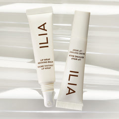 ILIA Lip Wrap Reviving Balm swatch on wrist shows subtle sheen and moisture.