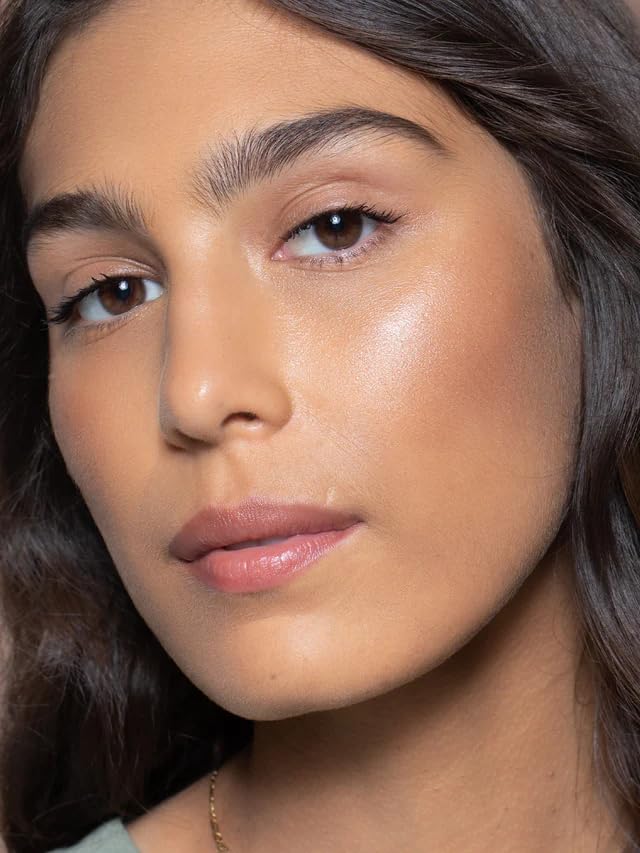 ILIA Multi-Stick fingertip application shows easy, skin-like blending.