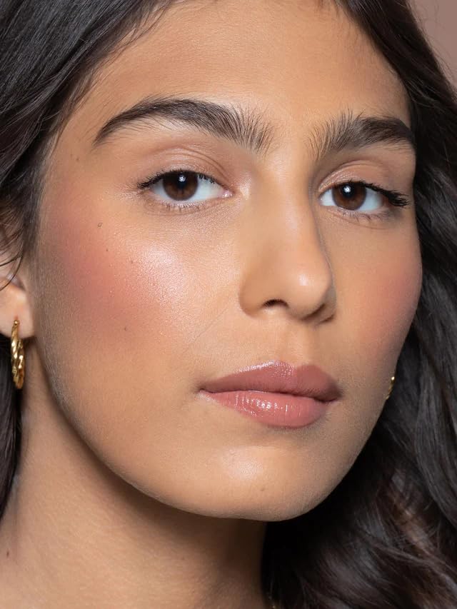 ILIA Multi-Stick fingertips usage demonstrating quick, natural lip-cheek blend.