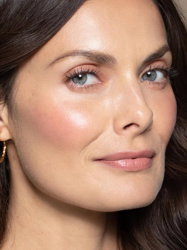 ILIA Multi-Stick Lady Bird blended on cheeks for a fresh, skin-like flush.