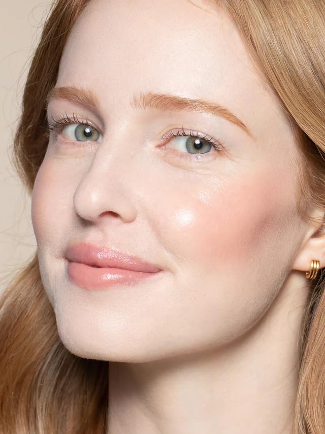 ILIA Multi-Stick Whisper on cheeks blending into a soft flush
