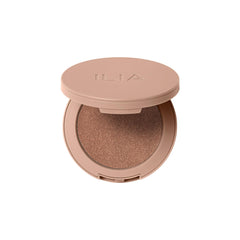 ILIA Sunshift Cream Bronzer Eclipse on cheekbone for peachy bronze glow with lasting wear