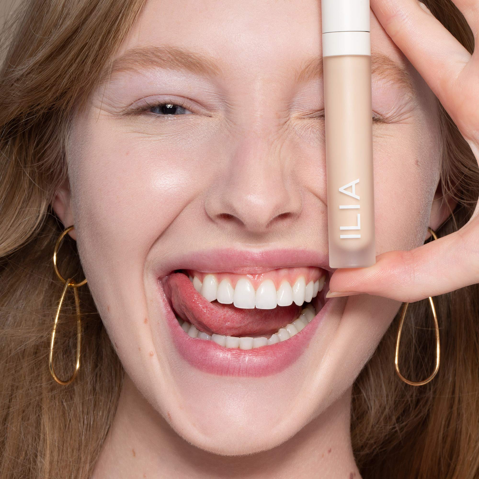 ILIA True Skin Serum Concealer applicator shown for precise under-eye coverage.