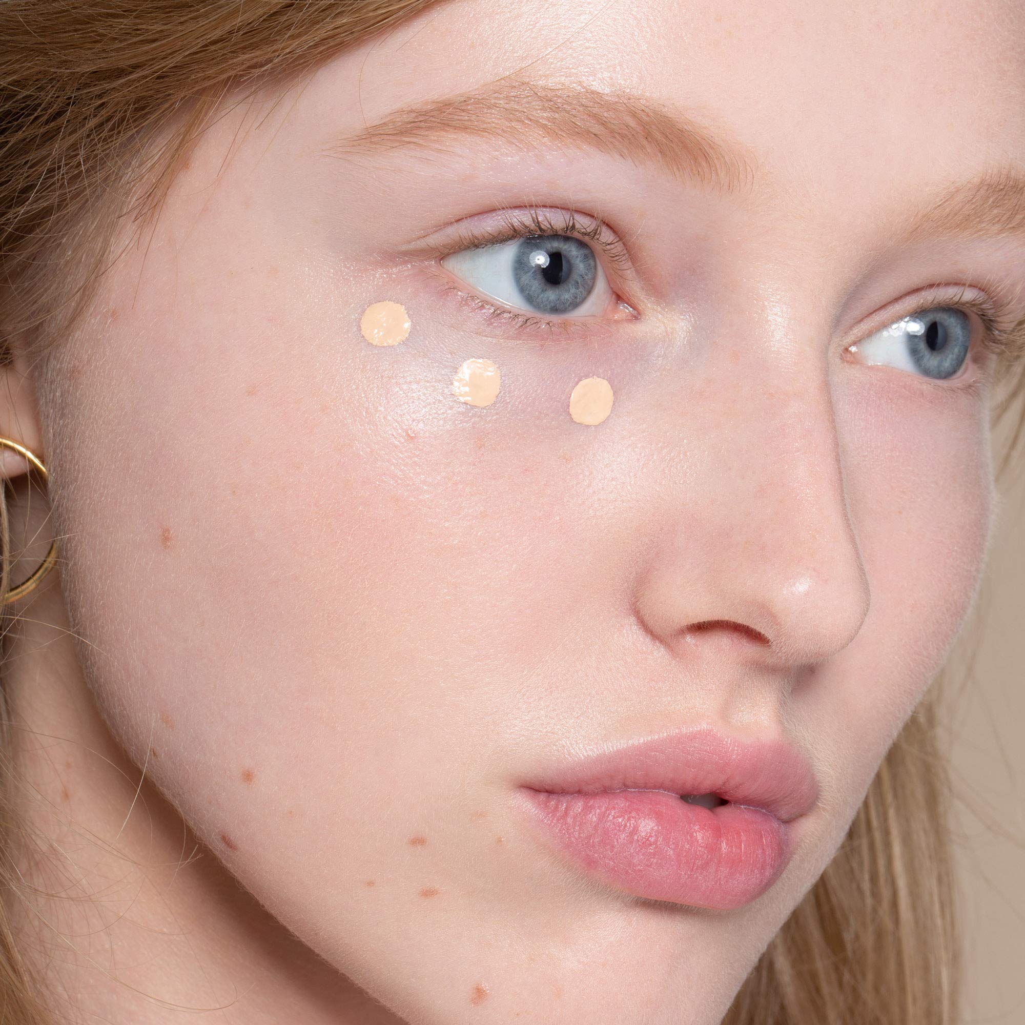 ILIA True Skin Serum Concealer under-eye area appears brighter after application.