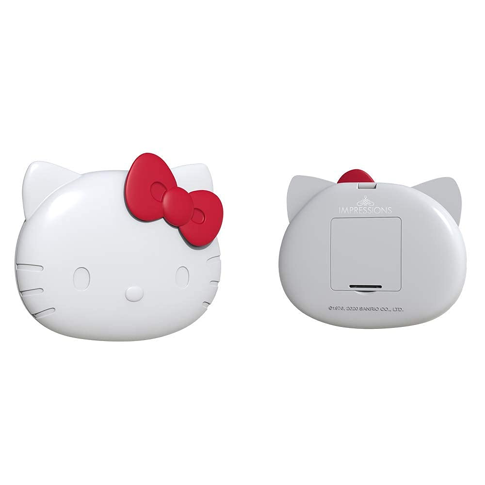 Impressions Vanity Hello Kitty compact mirror shown in purse for travel use