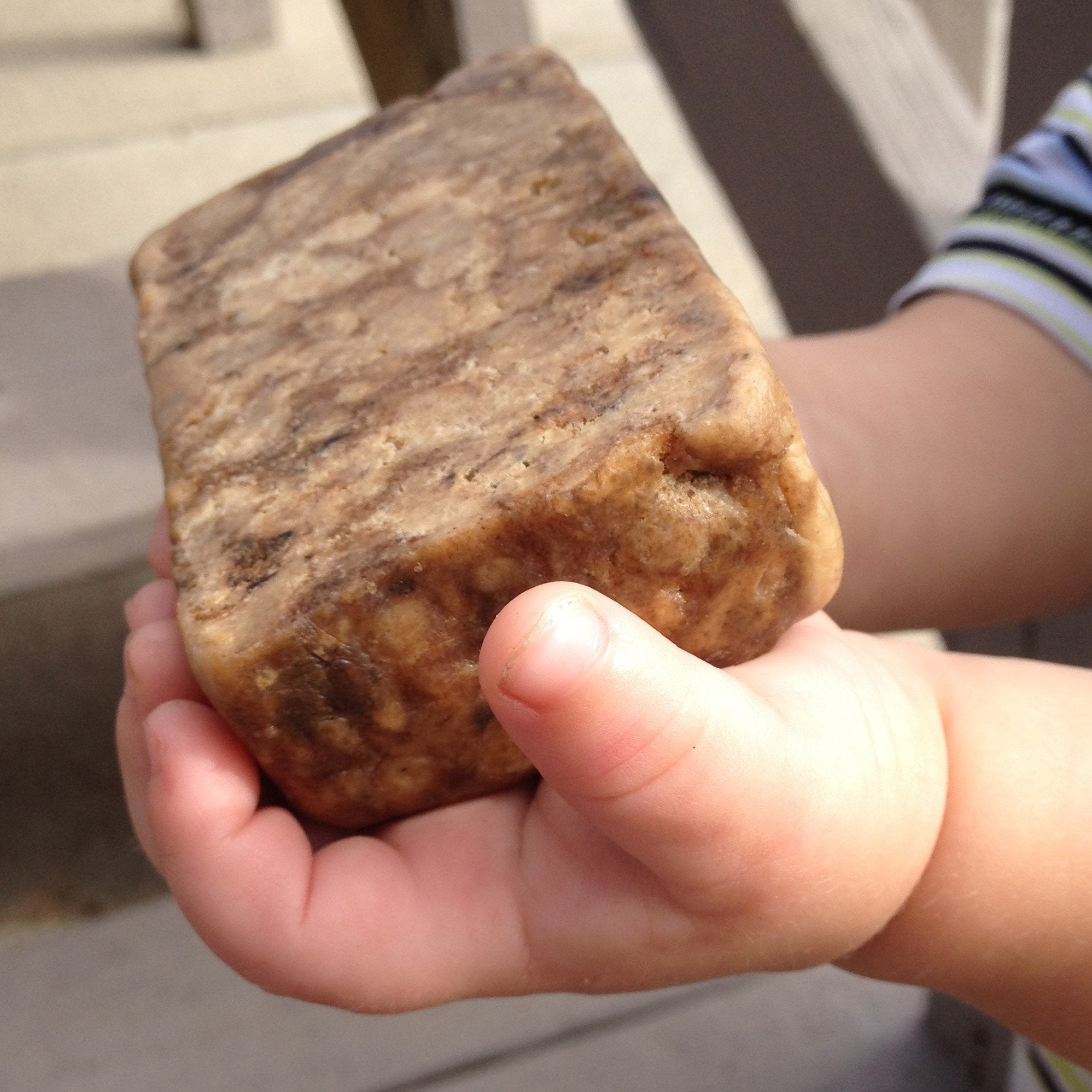 Incredible BY NATURE African Black Soap packaging highlighting natural ingredients and ethics.