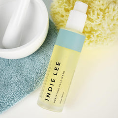 Indie Lee Purifying Face Wash orange-lavender essence for morning cleanse.