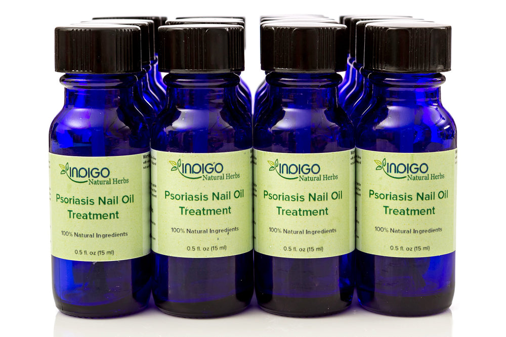 Indigo Natural Herbs Psoriasis Nail Oil Care on fingernails highlighting repair and strengthening benefits.