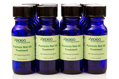 Indigo Natural Herbs Psoriasis Nail Oil Care on fingernails highlighting repair and strengthening benefits.
