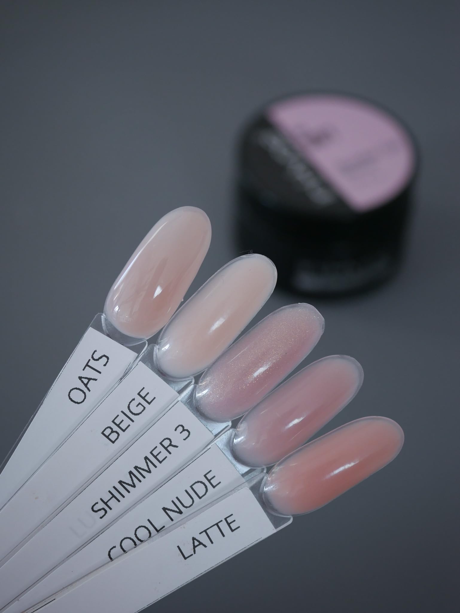 Elastic Base coat bottle shown to improve adhesion on thin nails
