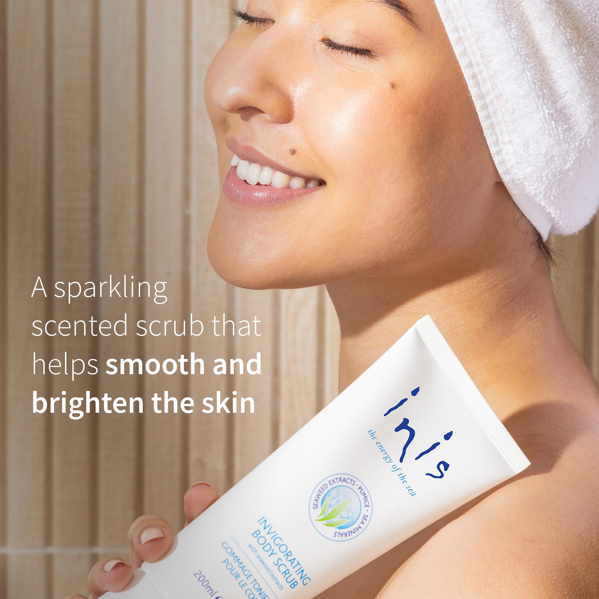 Inis the Energy of the Sea body scrub applying in circular motions for smooth skin