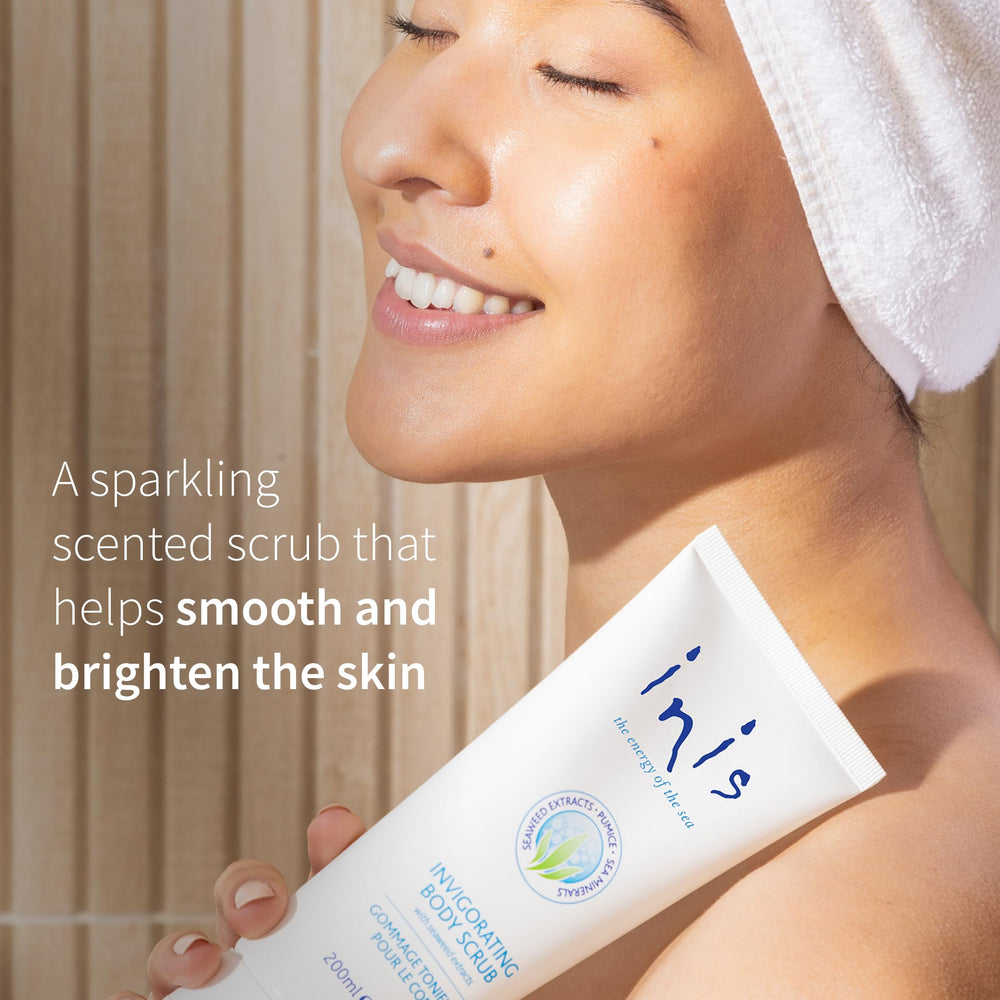 Inis the Energy of the Sea body scrub applying in circular motions for smooth skin
