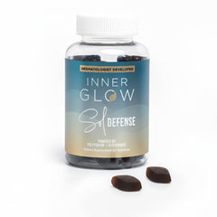 Inner Glow Sol Defense bottle on a vanity for daily skin resilience support.