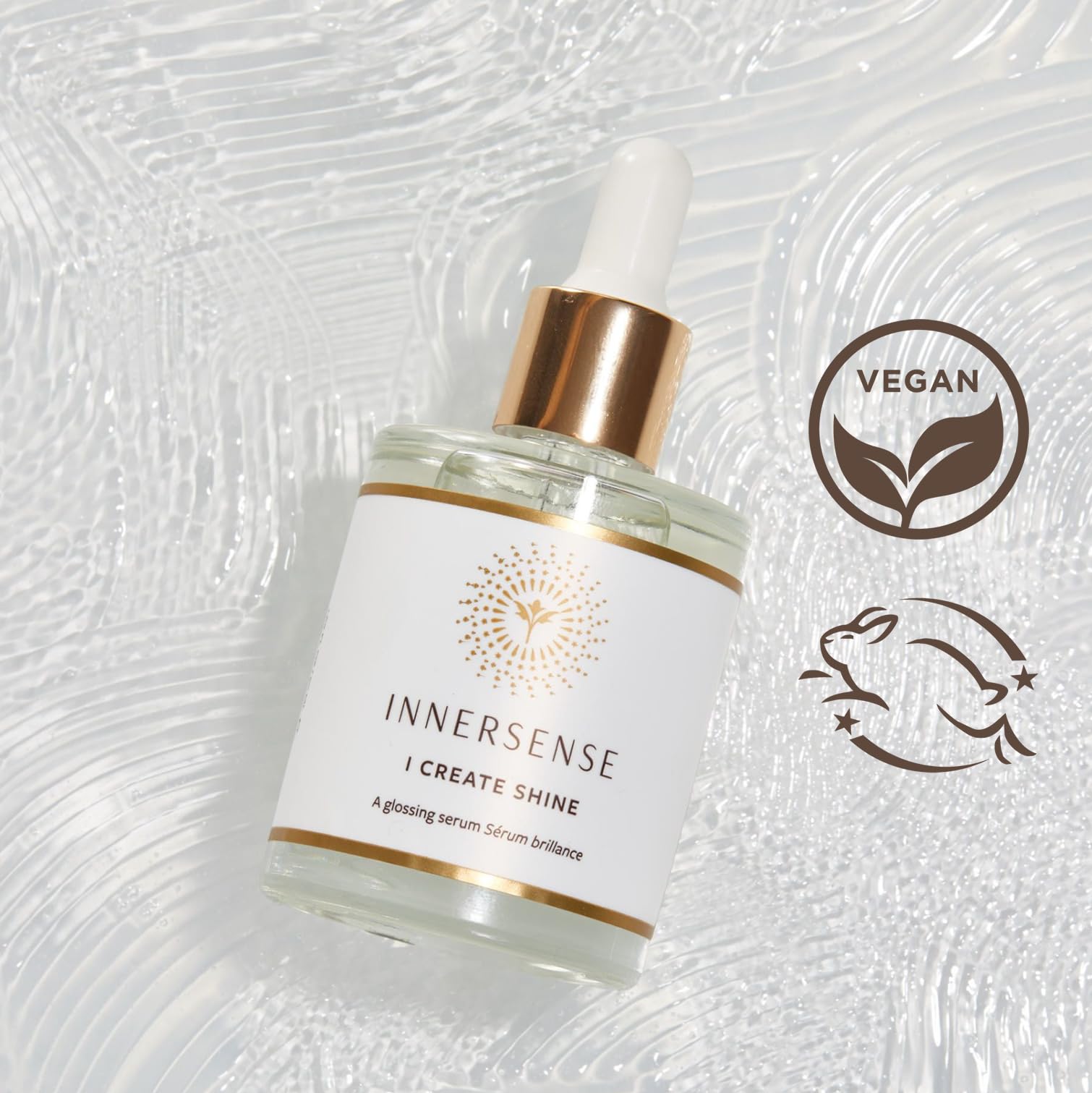 INNERSENSE Glossing Serum hand application shows fast absorption and radiant texture.