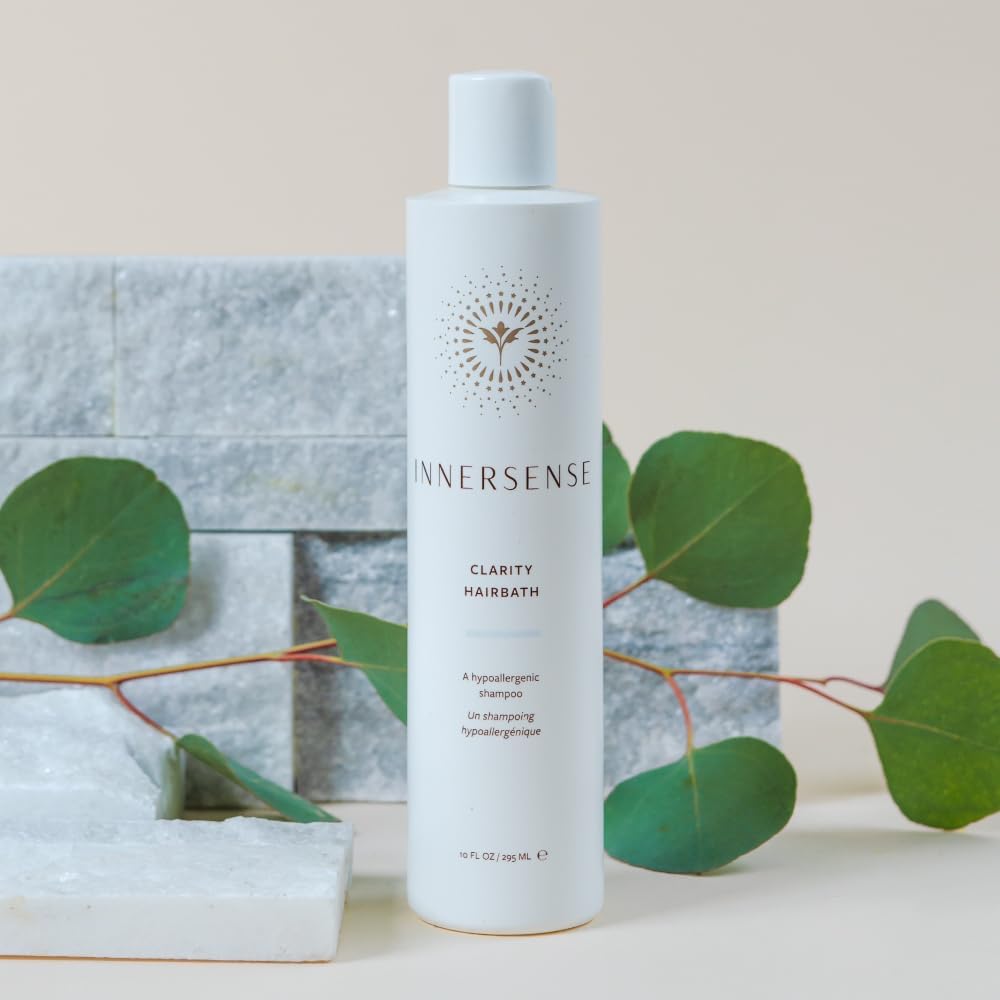 INNERSENSE Natural Clarity Hairbath hands with lather suggests gentle, allergy-friendly wash for all hair types.