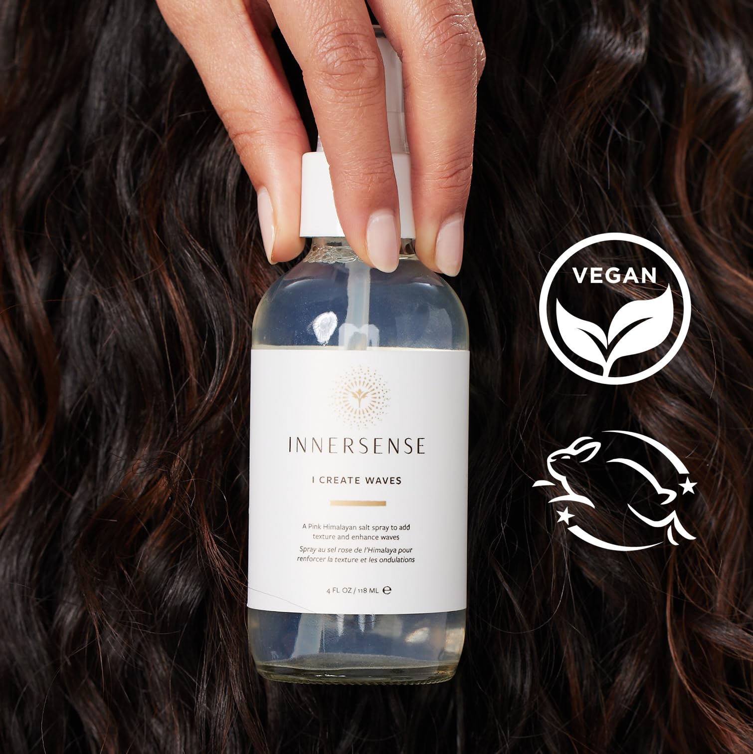 INNERSENSE pink salt spray-hair-application demonstrates easy styling for tousled, flexible hold.
