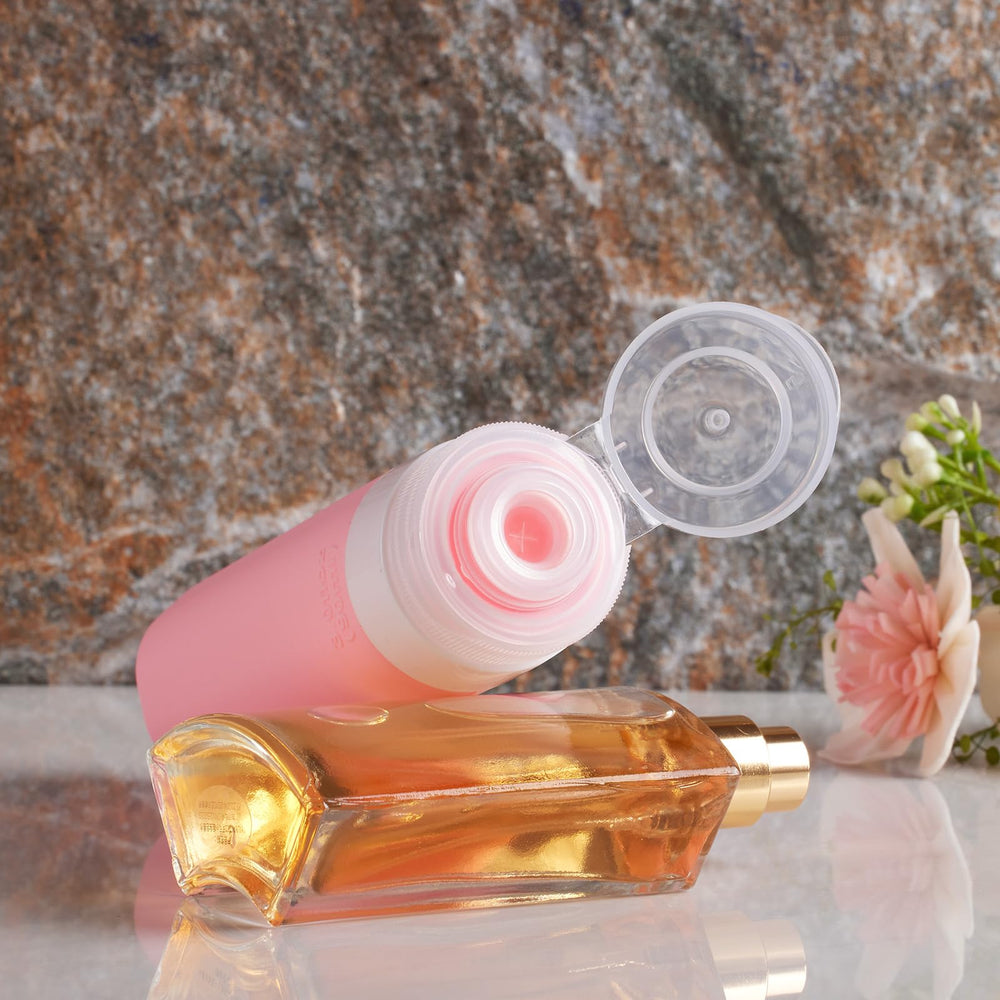 Botellas de silicona INSFIT de 2 oz para viaje, compactas y fáciles de llenar.