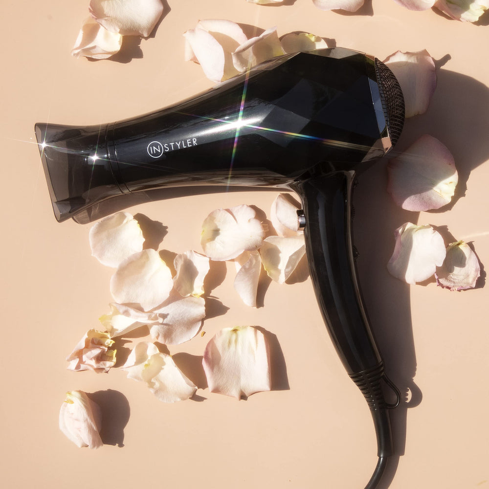 InStyler Turbo MAX Ionic Dryer handheld use in travel setup shows compact, lightweight design