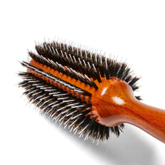 Ion Golden Wood Round Brush in action for thick, wavy hair volume and shine.