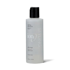 Ion Silk Drops bottle with hair application delivers smooth shine.