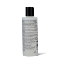 Ion Silk Drops close-up on hair delivering shine and silky softness.