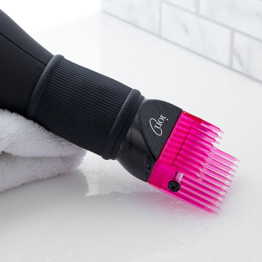 Ion Universal Hair Straightening Pic Attachment in use lifting and smoothing hair during blow-dry