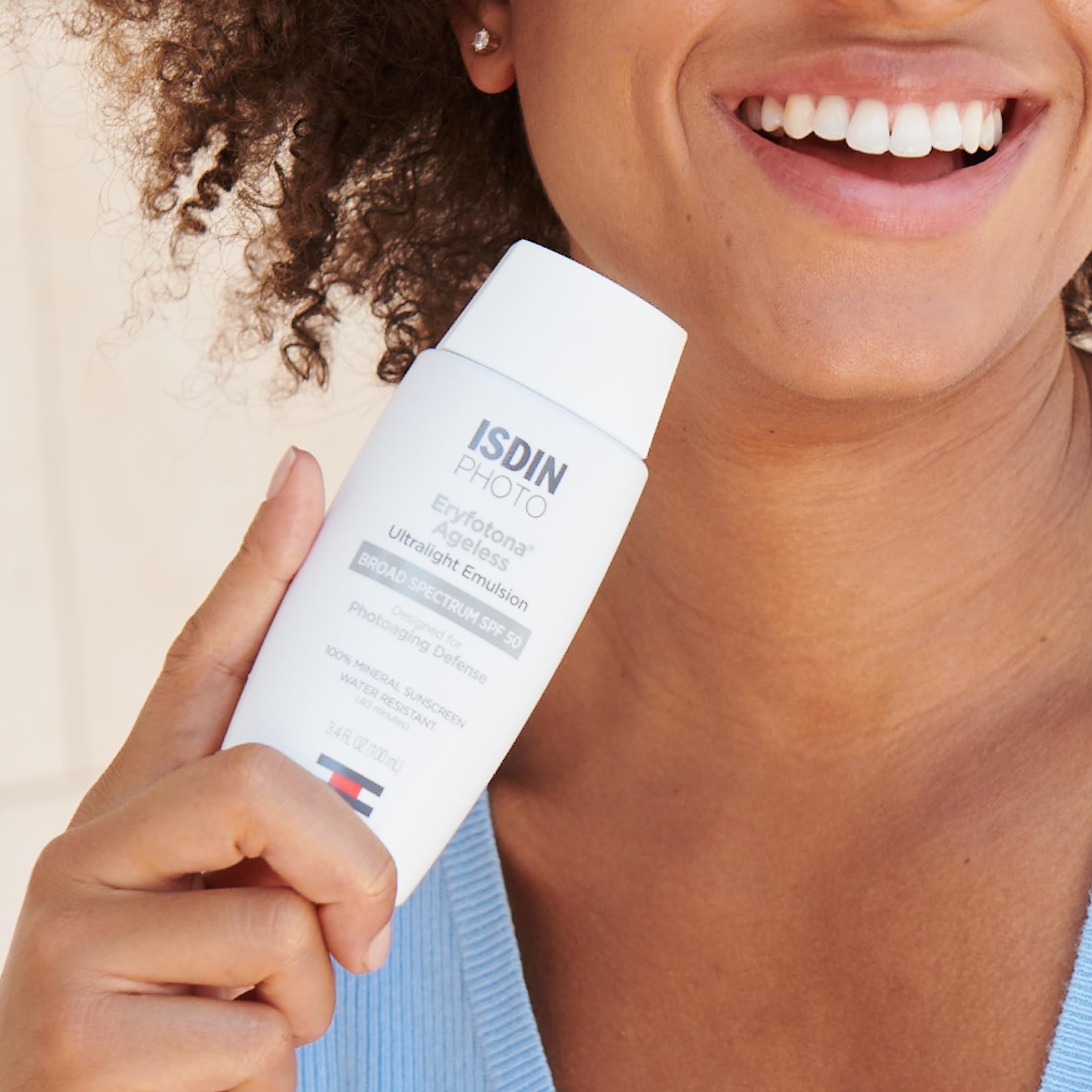 ISDIN Eryfotona Ageless tinted sunscreen close-up showing smooth texture and easy makeup-ready coverage.