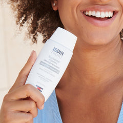 ISDIN Eryfotona Ageless tinted sunscreen close-up showing smooth texture and easy makeup-ready coverage.