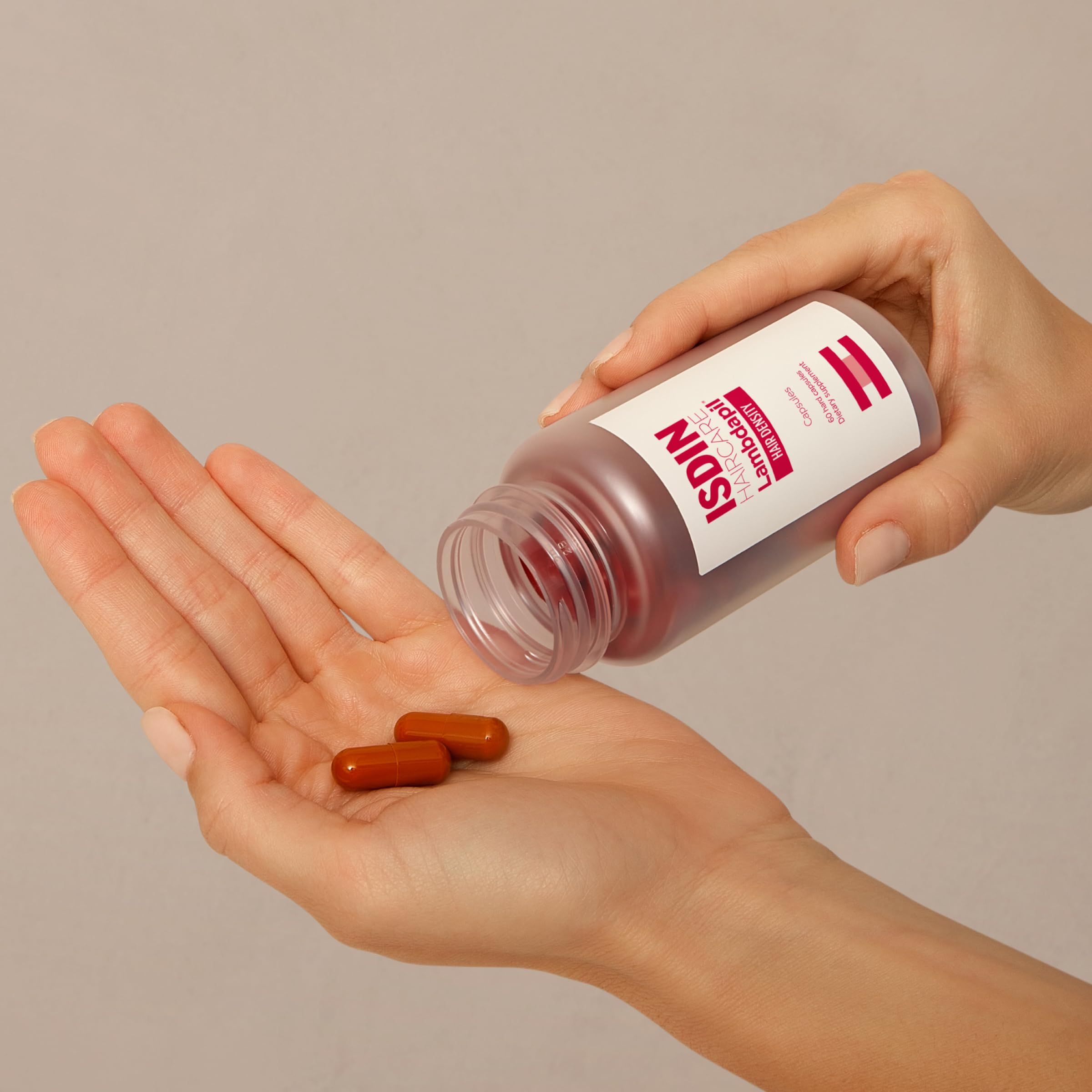 ISDIN Lambdapil capsules close-up highlighting vitamin-rich formula.