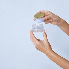 ISDIN Isdinceutics Eco-Refill dispense close-up shows fast-absorbing texture.