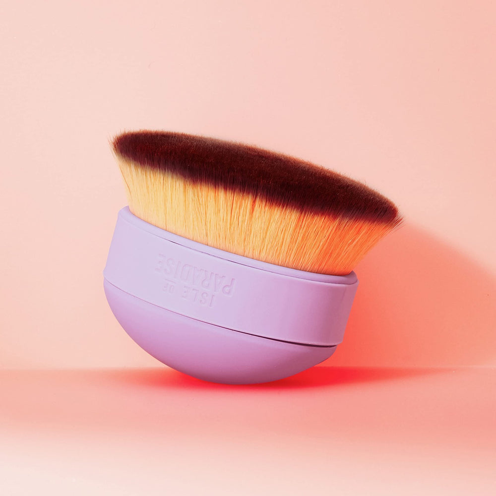 Isle of Paradise Shape and Glow brush shown on face and body for easy, even coverage.