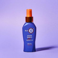 It's a 10 Haircare Miracle Leave-In Keratin Spray mist dispensing close-up for even coverage and moisture.