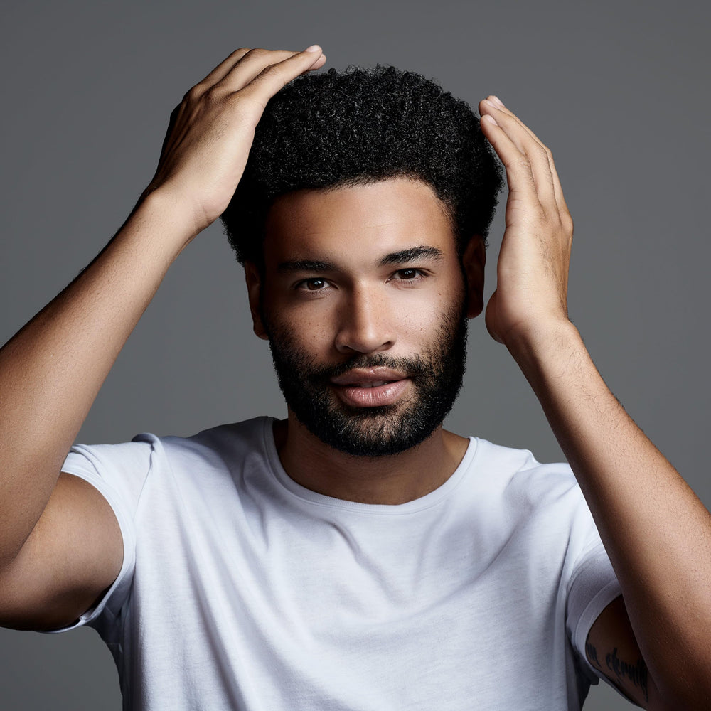 Jack Black Clay Pomade hands-warming demonstrates easy application and buildable hold.
