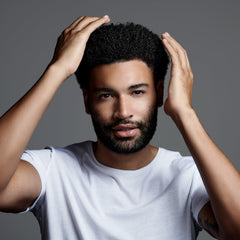 Jack Black Clay Pomade hands-warming demonstrates easy application and buildable hold.
