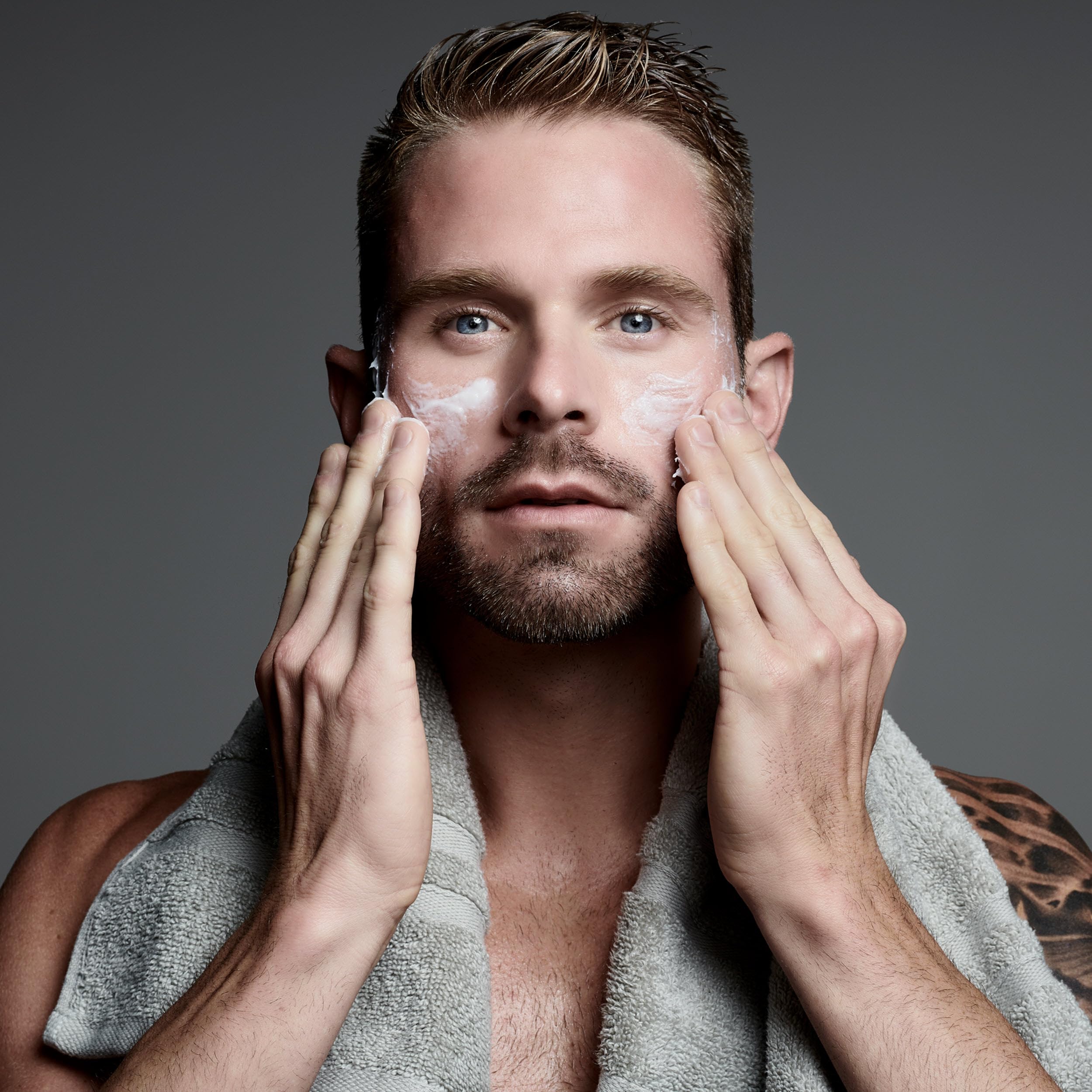 Jack Black Face Buff Energizing Scrub in shower routine for shaving prep and clear pores.