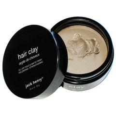 Jack Henry Premium Hair Clay jar closeup shows matte finish and natural scent.