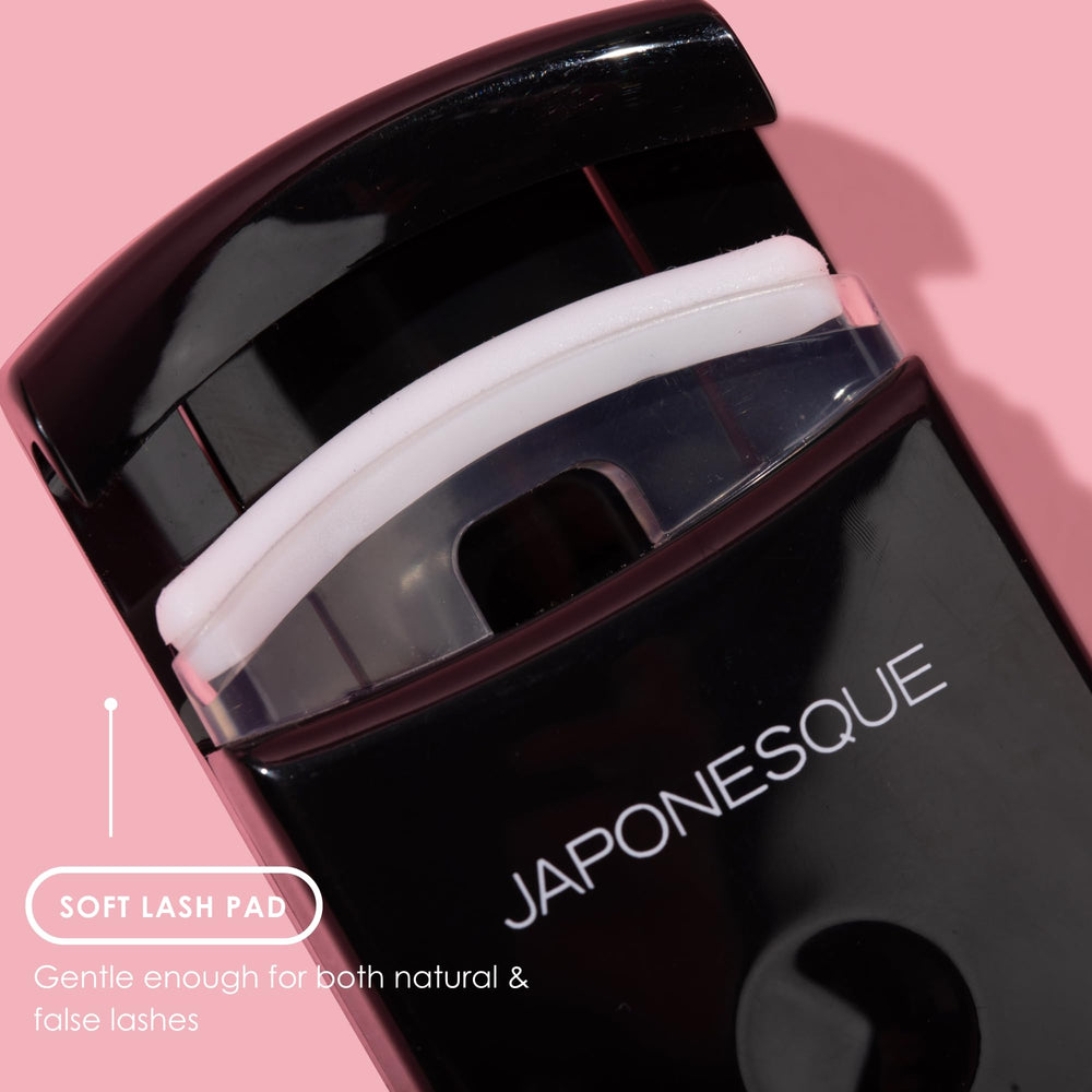 JAPONESQUE Travel Eyelash Curler Black 2 Pack in purse for on-the-go curling and quick definition.