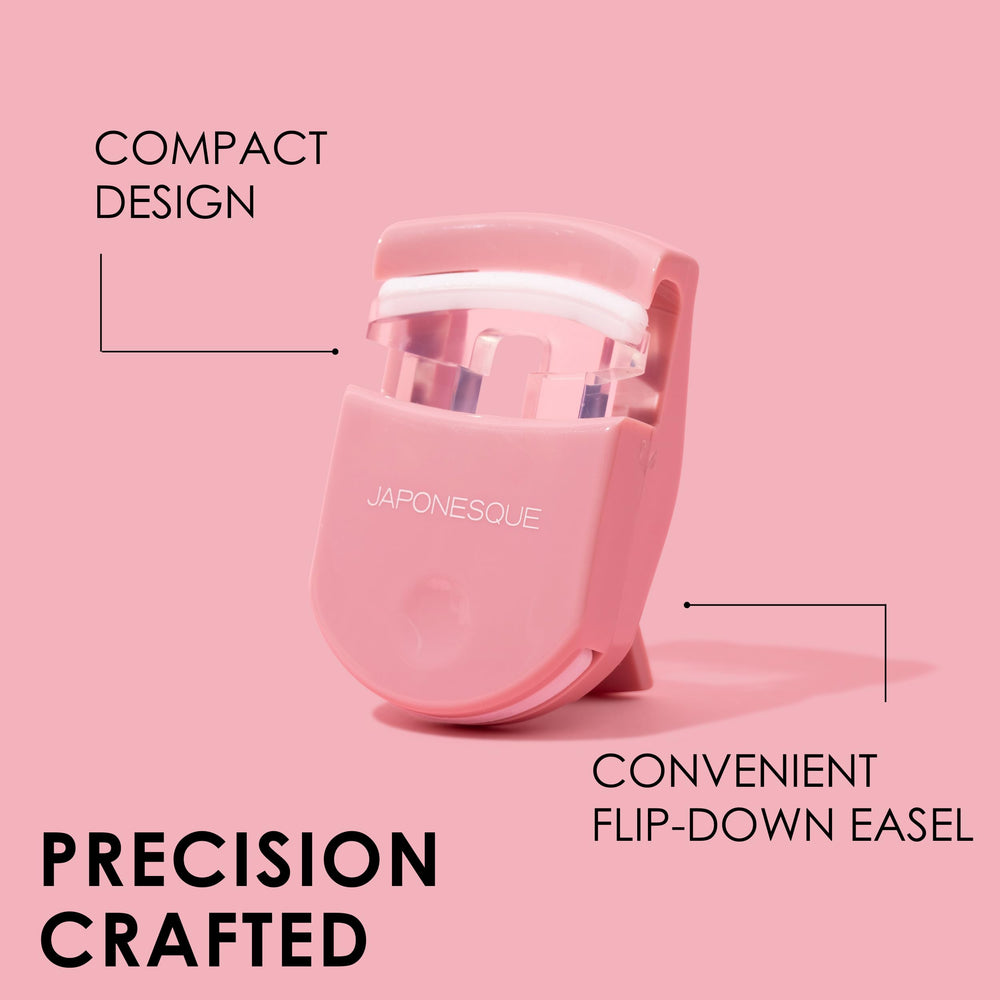 JAPONESQUE travel eyelash curler pink with bonus pad inside emphasizes easy replacement