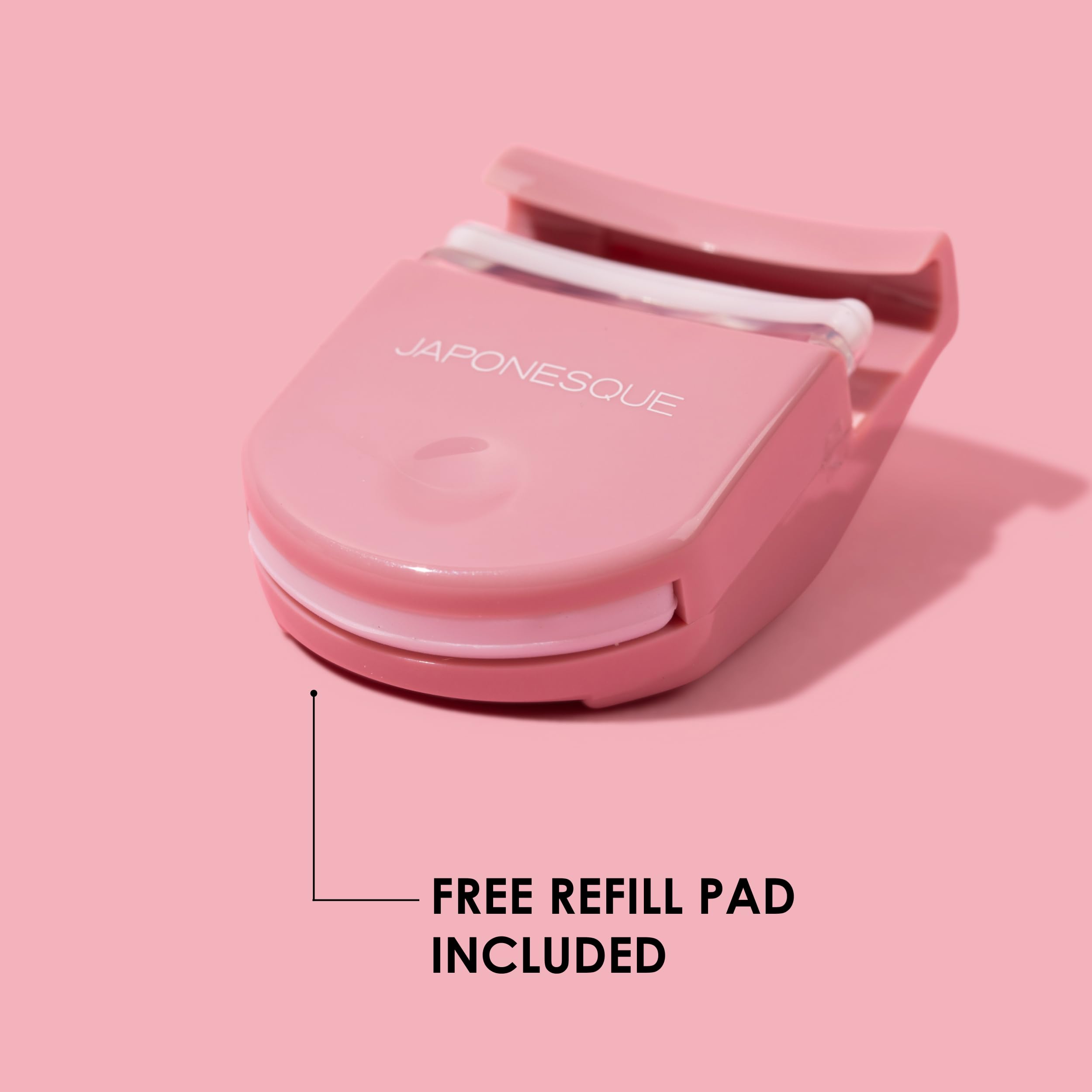 JAPONESQUE travel eyelash curler pink easel-down view demonstrates base squeeze for deeper curl