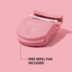 JAPONESQUE travel eyelash curler pink easel-down view demonstrates base squeeze for deeper curl