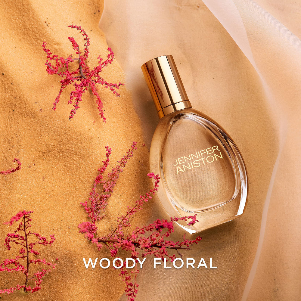 Jennifer Aniston Solstice Bloom dawn glow shot emphasizes fresh start fragrance moment.