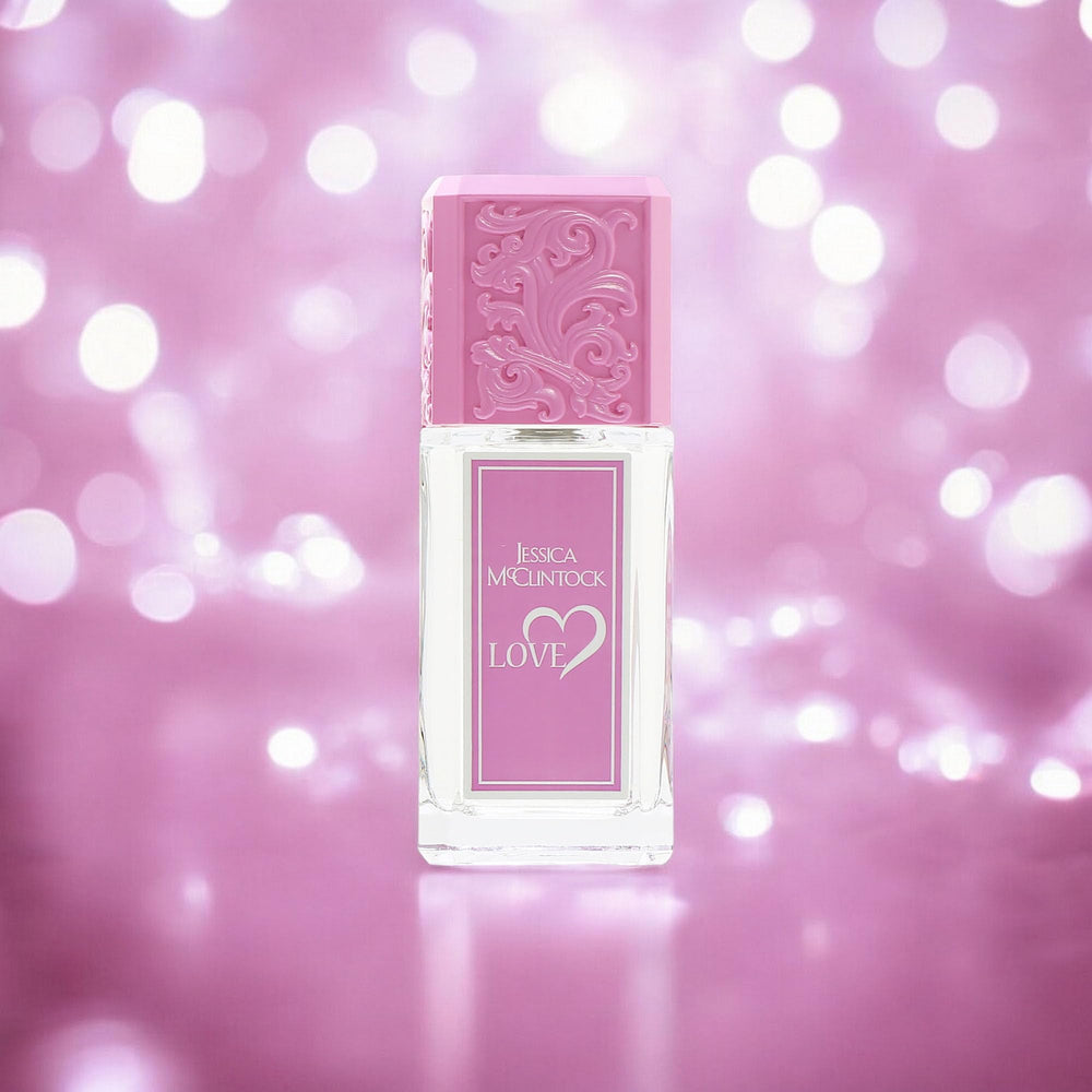 Love by Jessica McClintock bottle on vanity with soft light for daily elegance.
