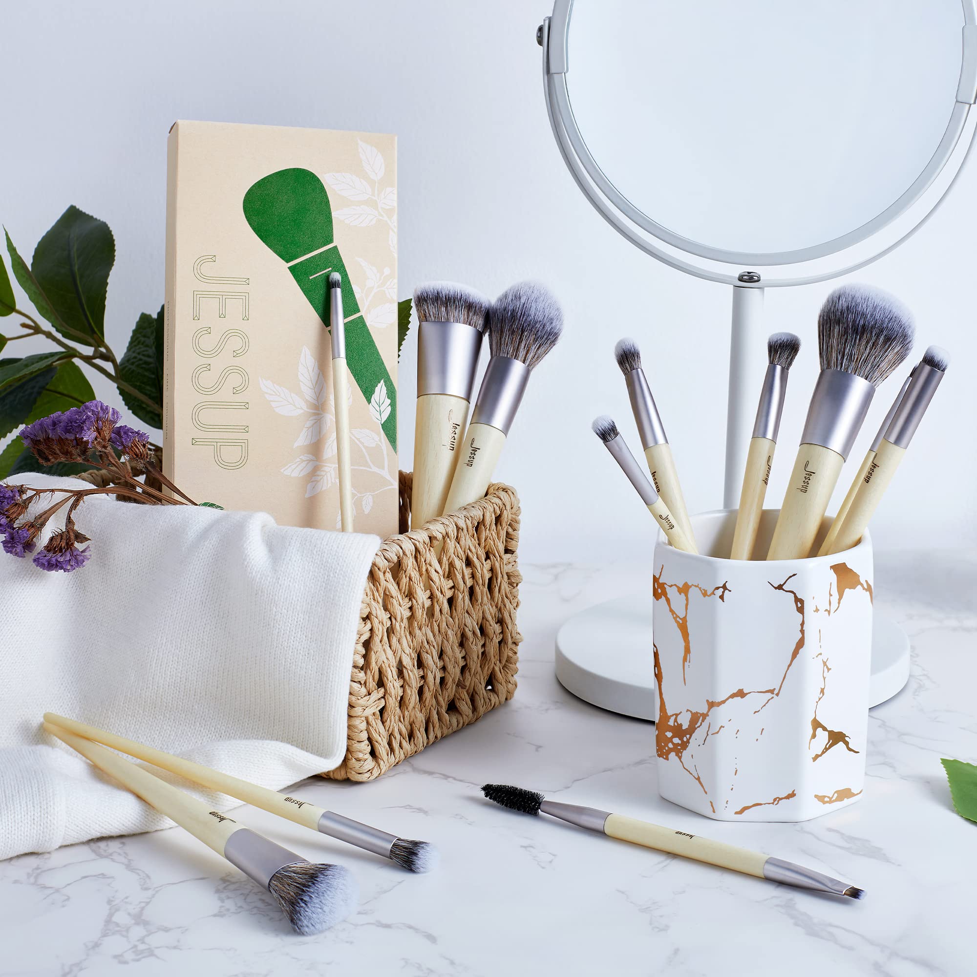 Jessup eyeshadow brush applies and blends color across lid for seamless transitions.
